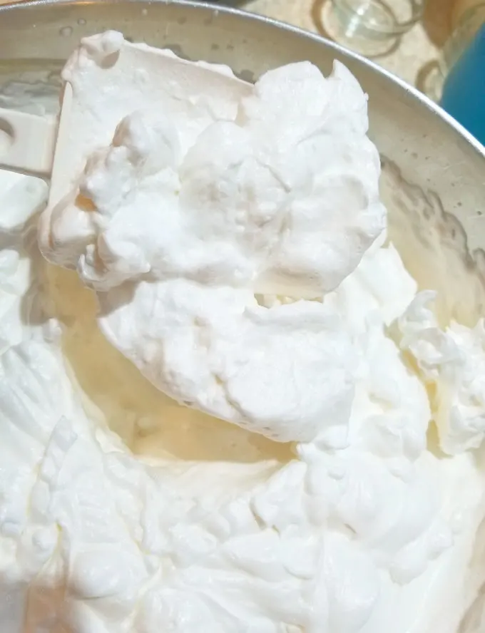 The photos shows a meringue for angel food cake that is too coarse because it was whipped at high speed.