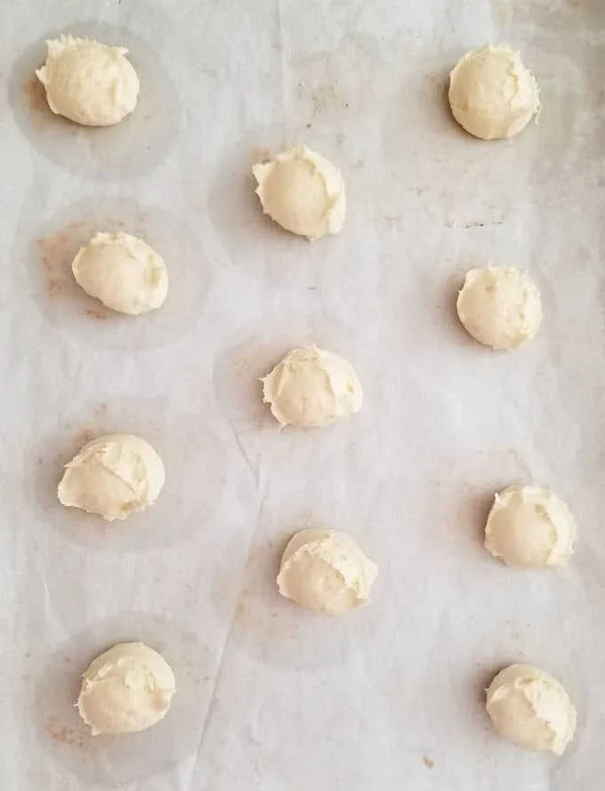 scooped batter for Lemon Thin Cookies on a sheet pan