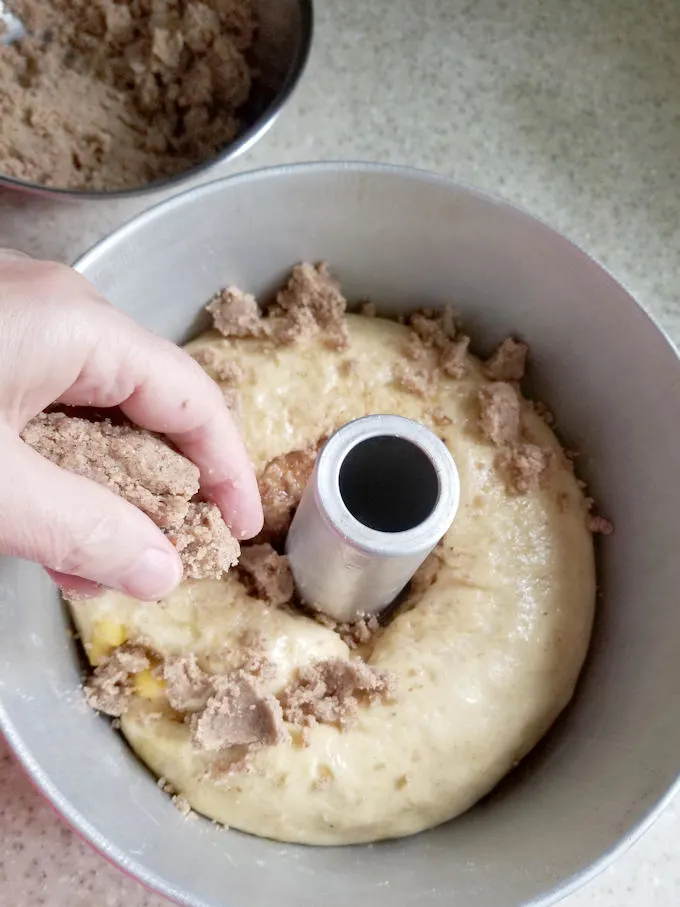 Crumbling on topping for a coffee cake