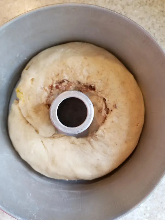 a peach & pecan streusel coffee cake in a tube pan