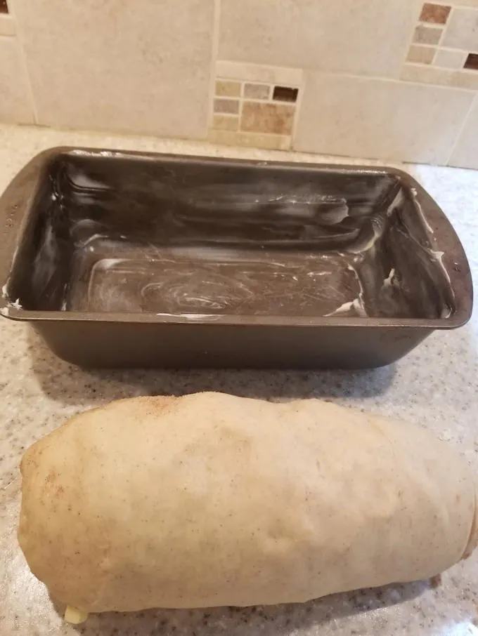 fresh apple cinnamon swirl bread ready for the pan