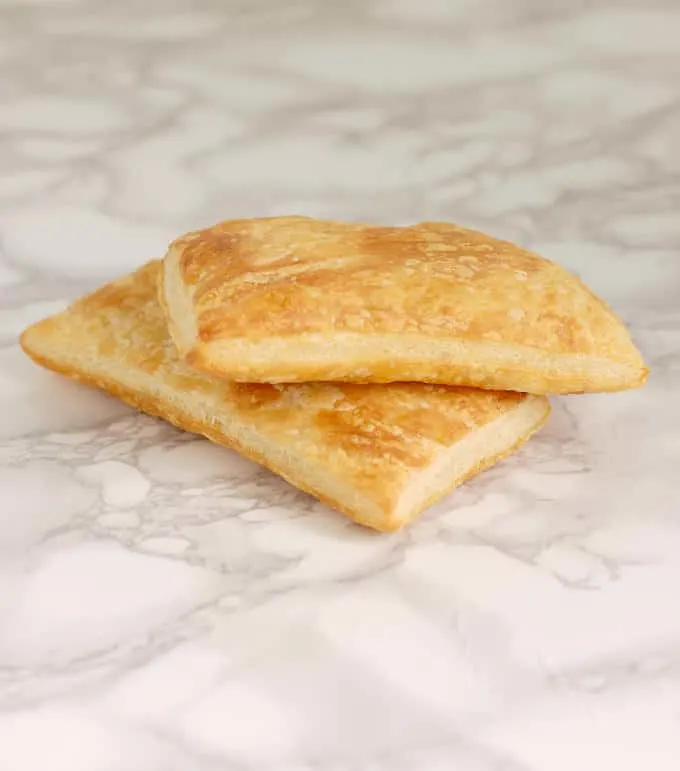 two pieces of baked classic puff pastry