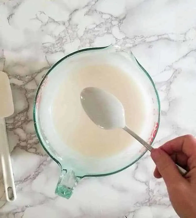 fondant icing coating the back of a spoon