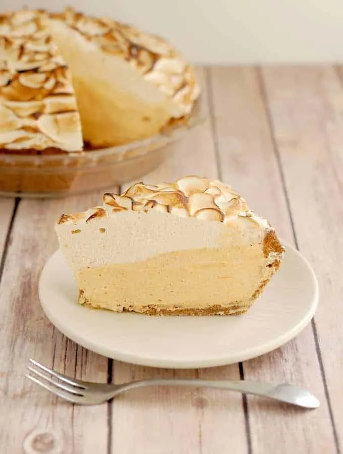 a slice of pumpkin mousse pie on a plate.