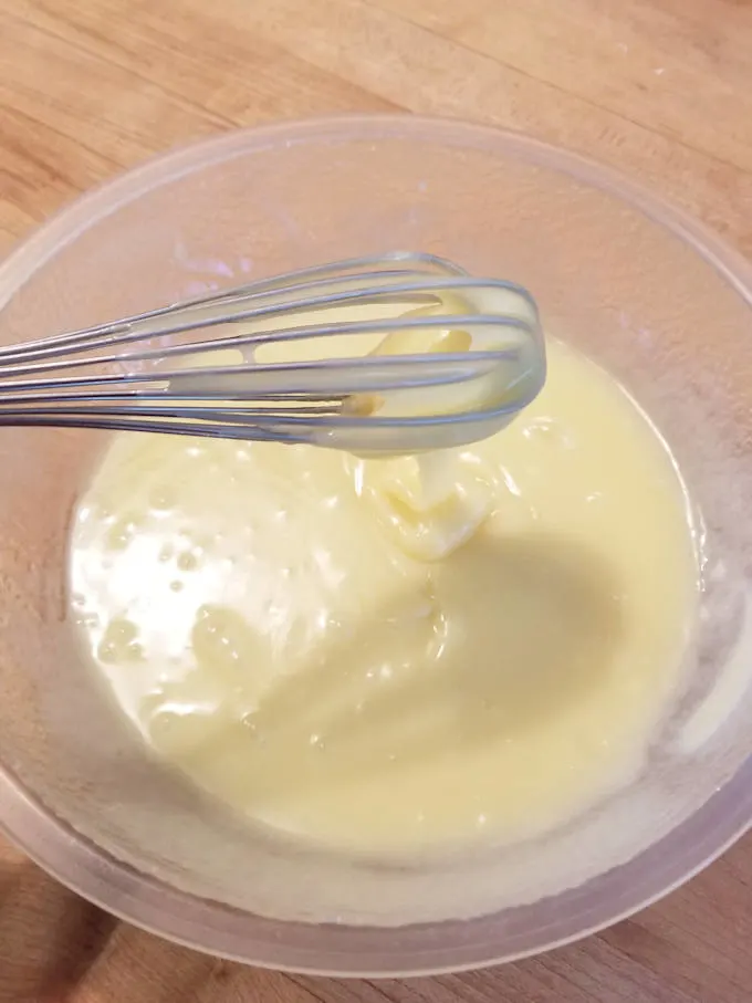 a bowl of white chocolate glaze