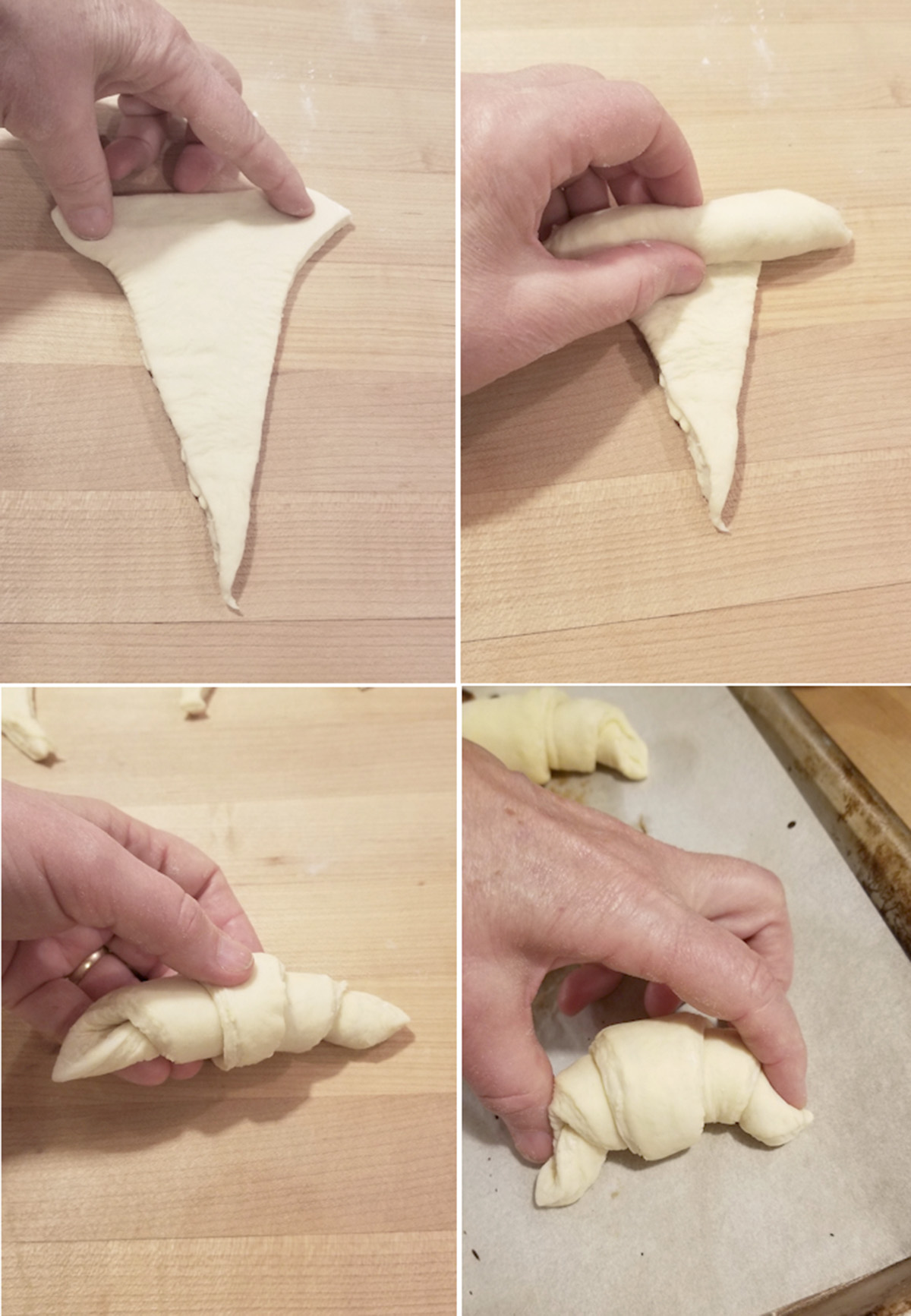a hand rolling a croissant.