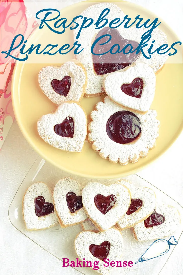 Raspberry Linzer Cookies are the perfect little cookie - Tender almond cookie dough sandwiched with raspberry preserves. Just a hint of rum gives the cookie a special flavor. #linzer  #cookies #raspberry #easy #best #recipe #valentine