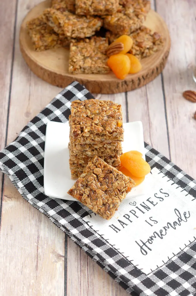 sunflower, pecan and apricot granola bars on a plate