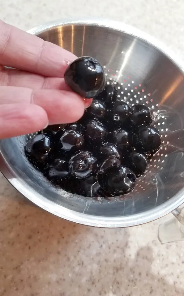 a closeup shot of marinated cherries