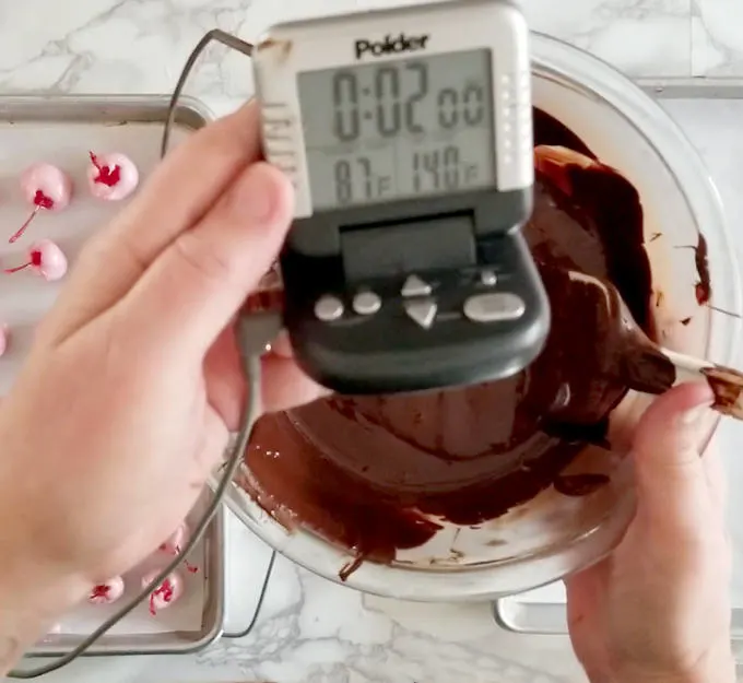 Measuring the temperature of chocolate in a bowl. Special infrared
