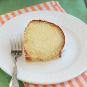 a slice of irish whisky cake on a white plate.