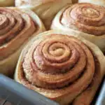 a pan of baked cinnamon buns