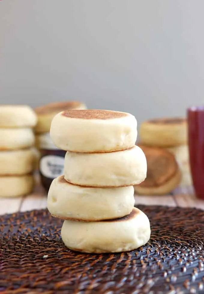 a stack of sourdough english muffins