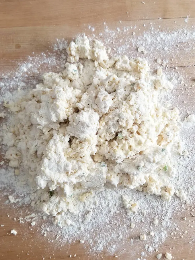 unkneaded scone dough on a floured surface