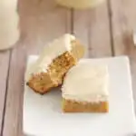 two malted milk blondies on a white plate