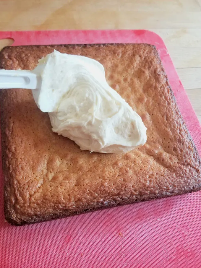 A blob of frosting on a malted milk blondies.