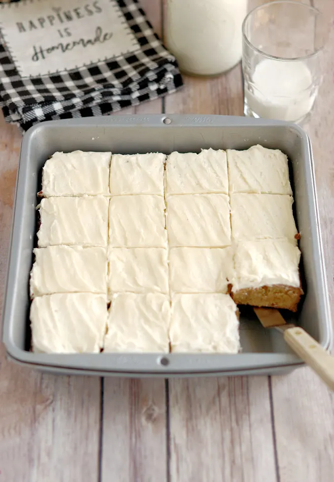 a tray of malted milk blondies with malted milk frosting.