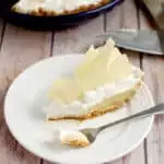 a slice of malted milk cream pie on a plate with a fork