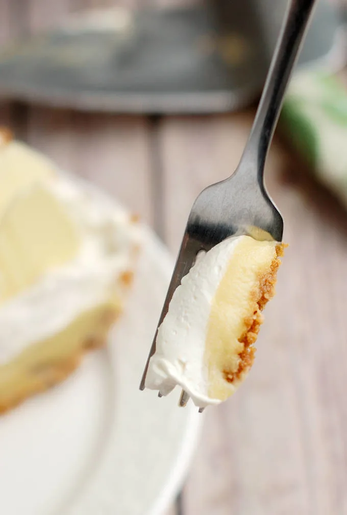 a fork holding a bite of malted milk cream pie