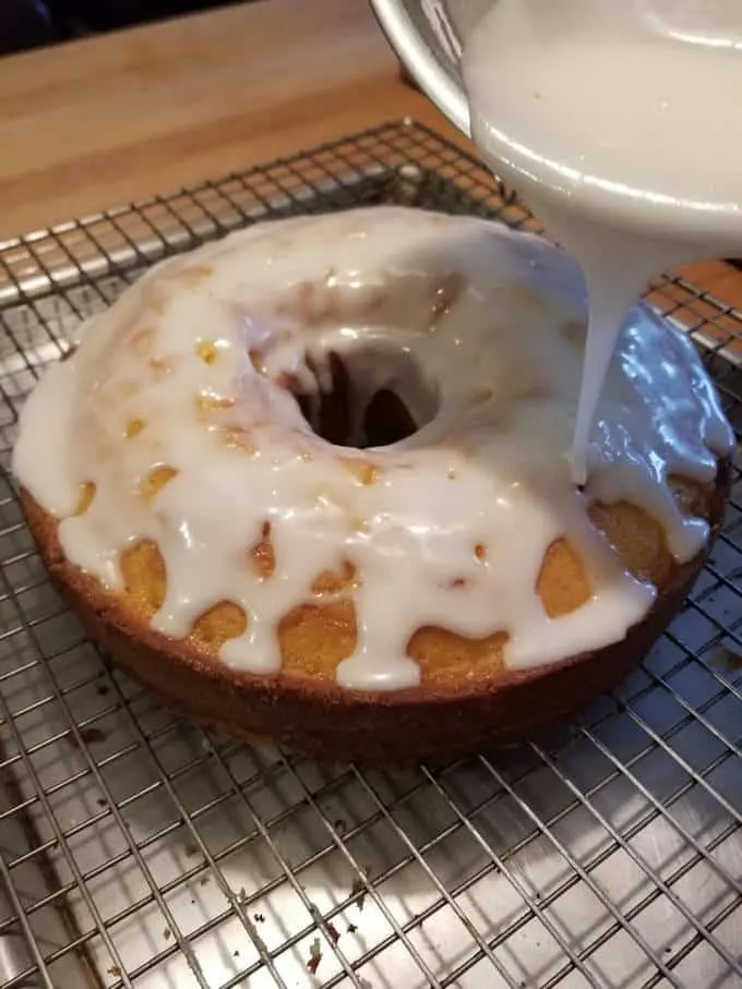 A cake being glazed.