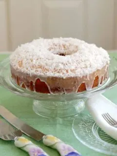 a coconut pound cake on a cake stand
