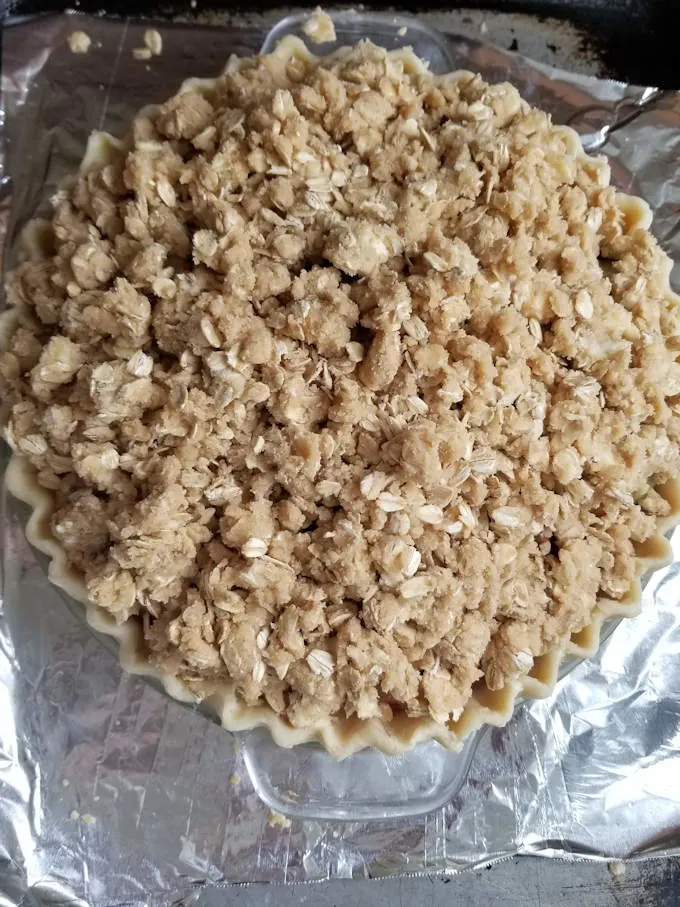 a rhubarb crumb pie ready for the oven