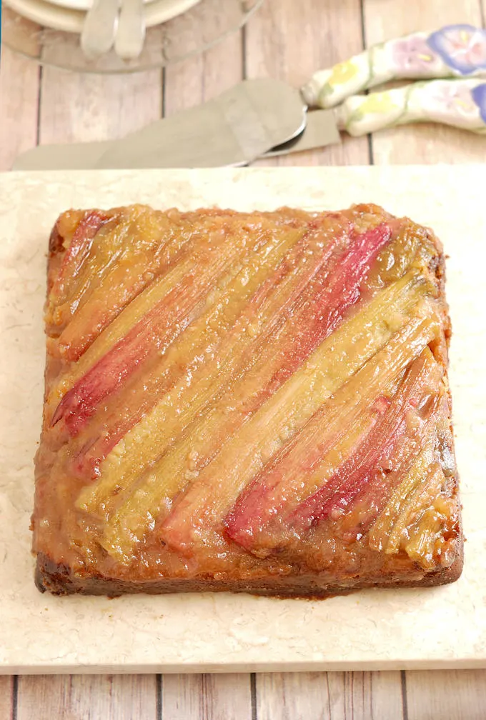 rhubarb upside down cake on a marble tray.