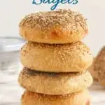 a stack of sourdough bagels with text overlay for pinterest