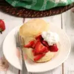 a strawberry shortcake on white plate