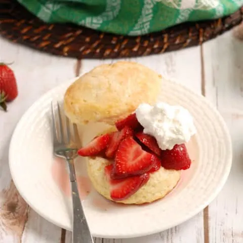 a strawberry shortcake on white plate