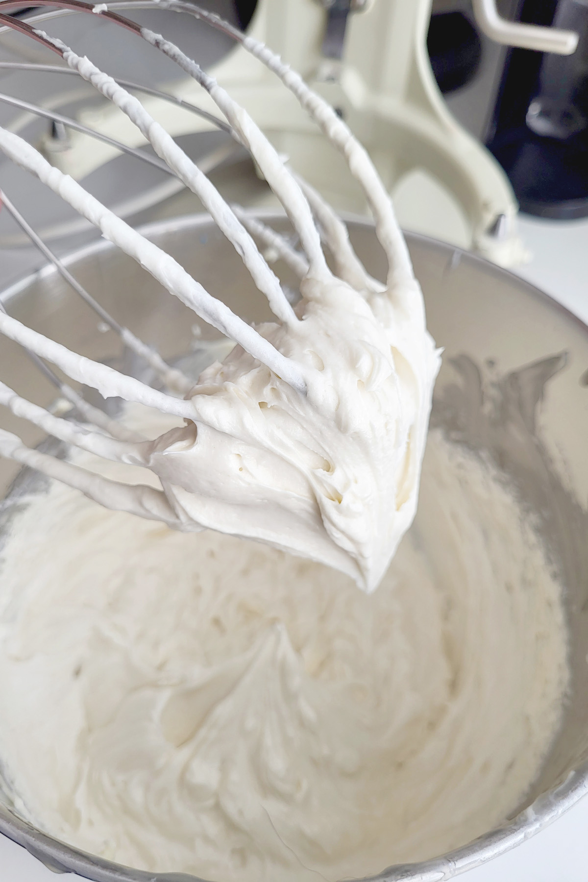 whipped cream on a whisk.
