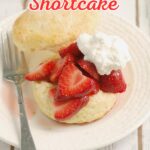 a strawberry shortcake on a white plate.
