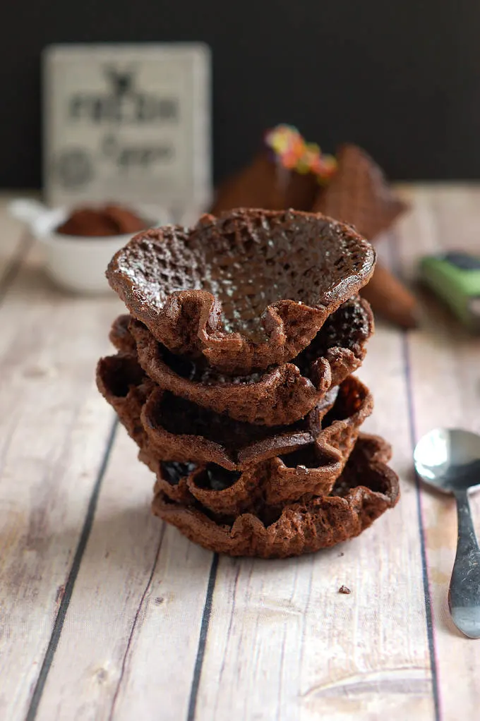 a stack of chocolate waffle cone bowls
