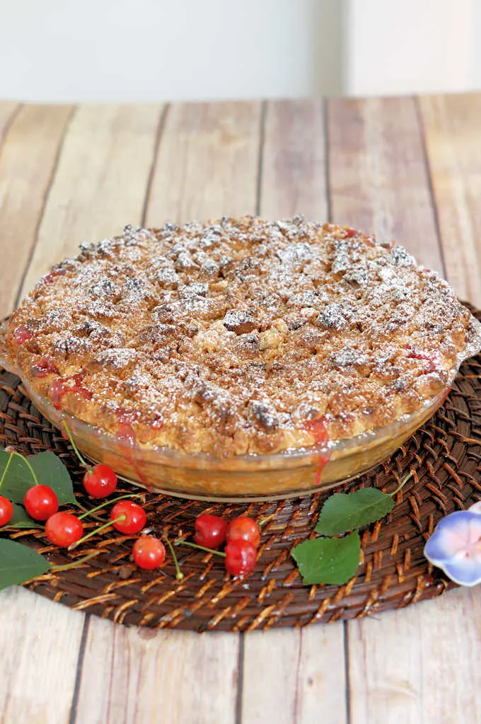 a sour cherry crumb pie on a table