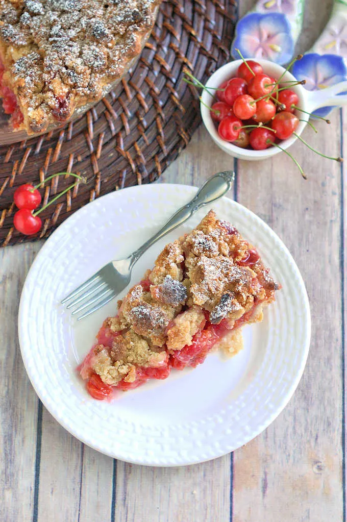 a slice of cherry crumb pie