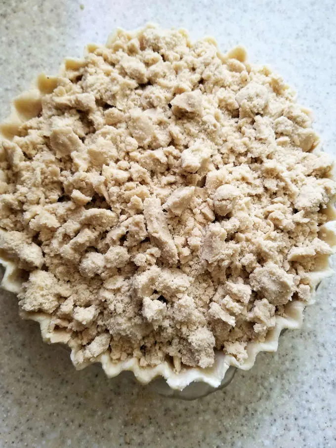a sour cherry crumb pie ready for the oven