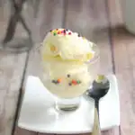 a bowl of vanilla ice cream with sprinkles