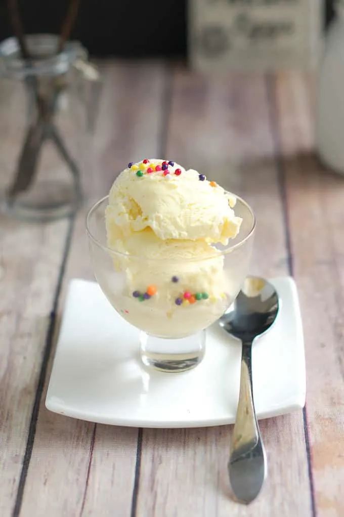 a bowl of vanilla ice cream with sprinkles