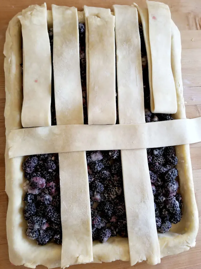 weaving a lattice top for a blackberry slab pie 