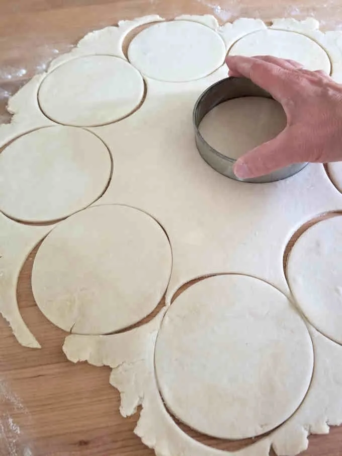 cutting circles from a sheet of pie dough