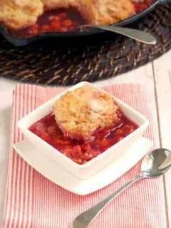 a bowl of sour cherry cobbler