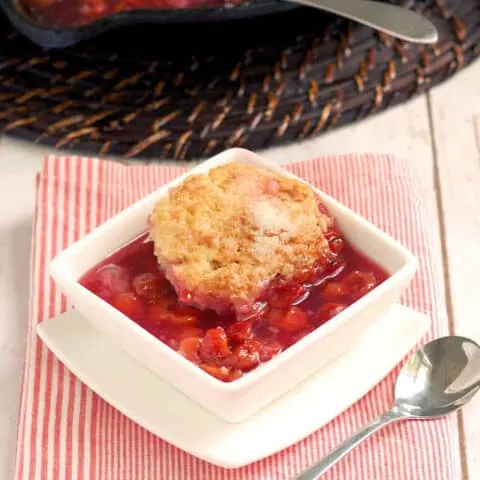 a bowl of sour cherry cobbler