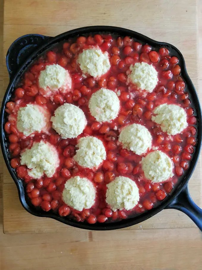 a cherry cobbler ready for the oven