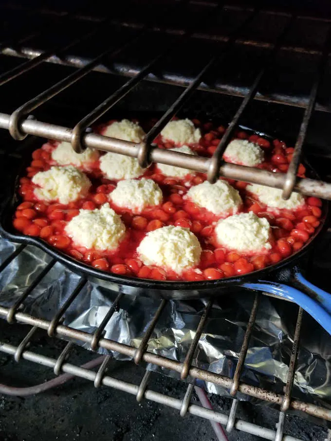 a cherry cobbler in the oven