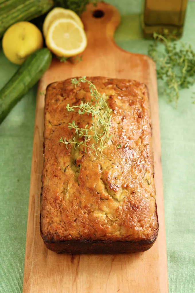 a loaf of lemon zucchini bread with olive oil and thyme