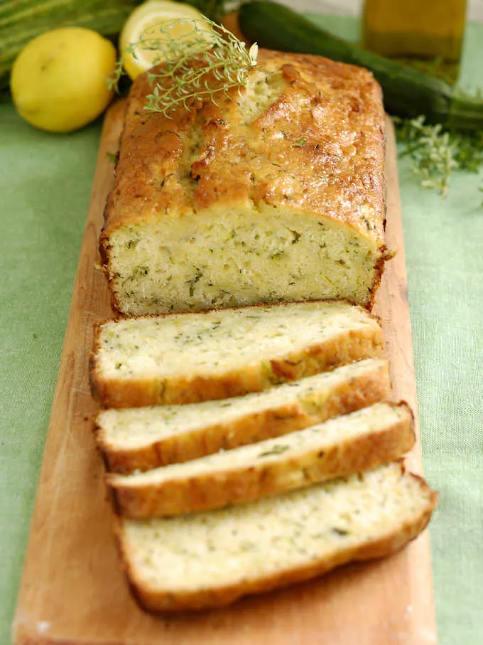 a sliced loaf of lemon zucchini bread