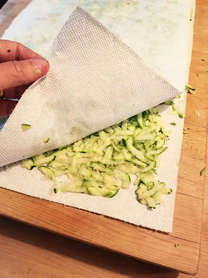 shredded zucchini on paper towels