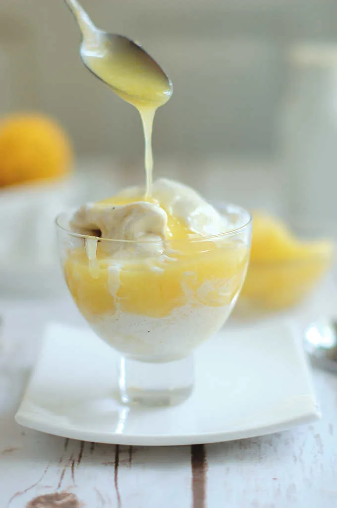 a bowl of ice cream with lemon curd topping