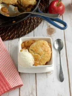 a bowl of apple cobbler with a scoop of ice cream