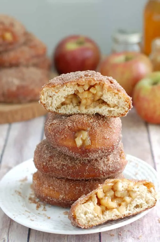 apple filled cider donuts on a plate.